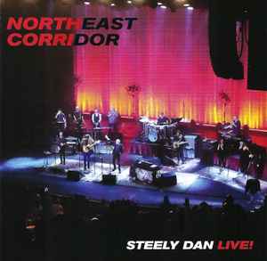 The image is of the album cover for "Northeast Corridor Steely Dan Live!"